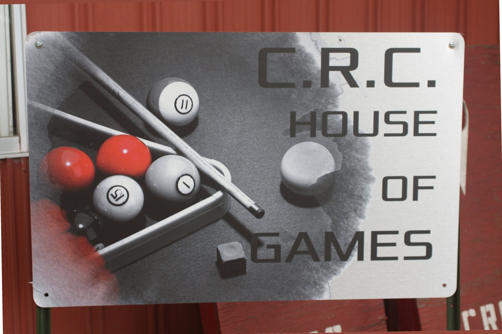 CRC Game Room sign with a billiard theme background